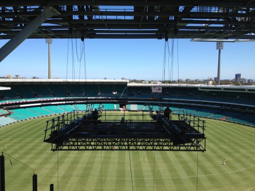 an elevated work platform suspended over the SCG playing surface